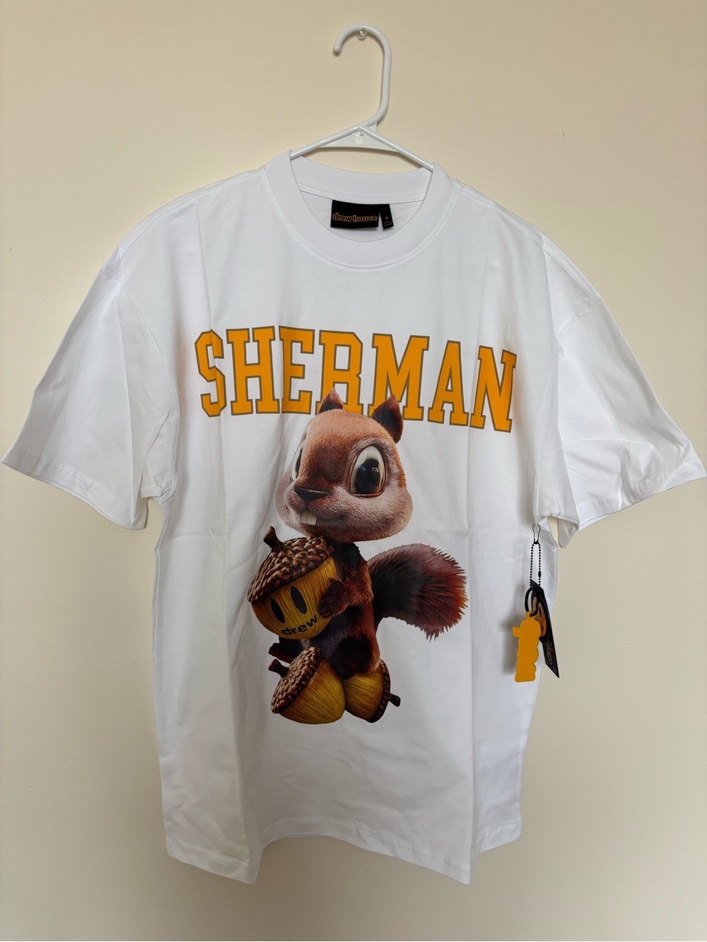 drew house White Tee with Yellow SHERMAN Logo and Squirrel Graphic